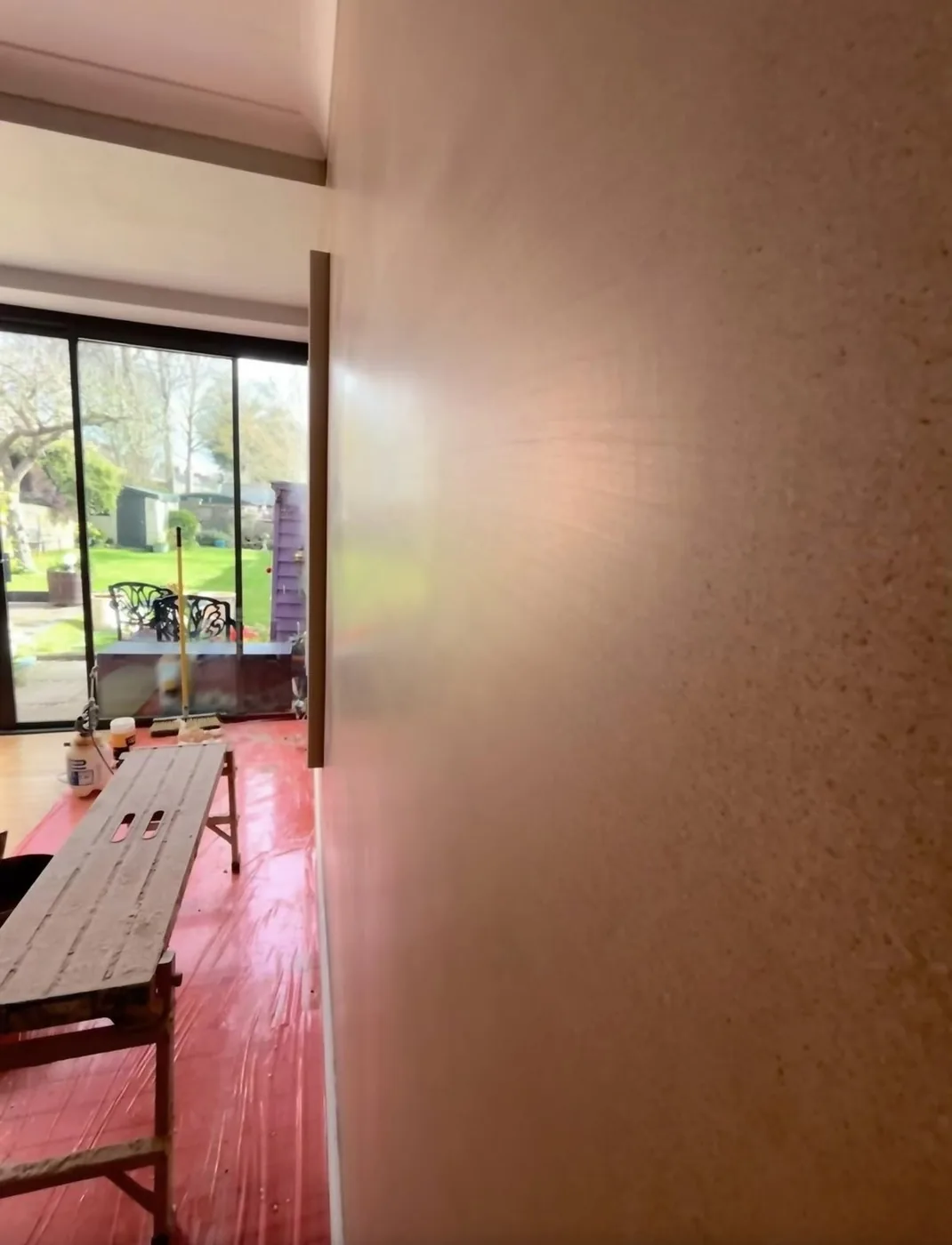 Freshly skimmed wall beside glazed garden doors