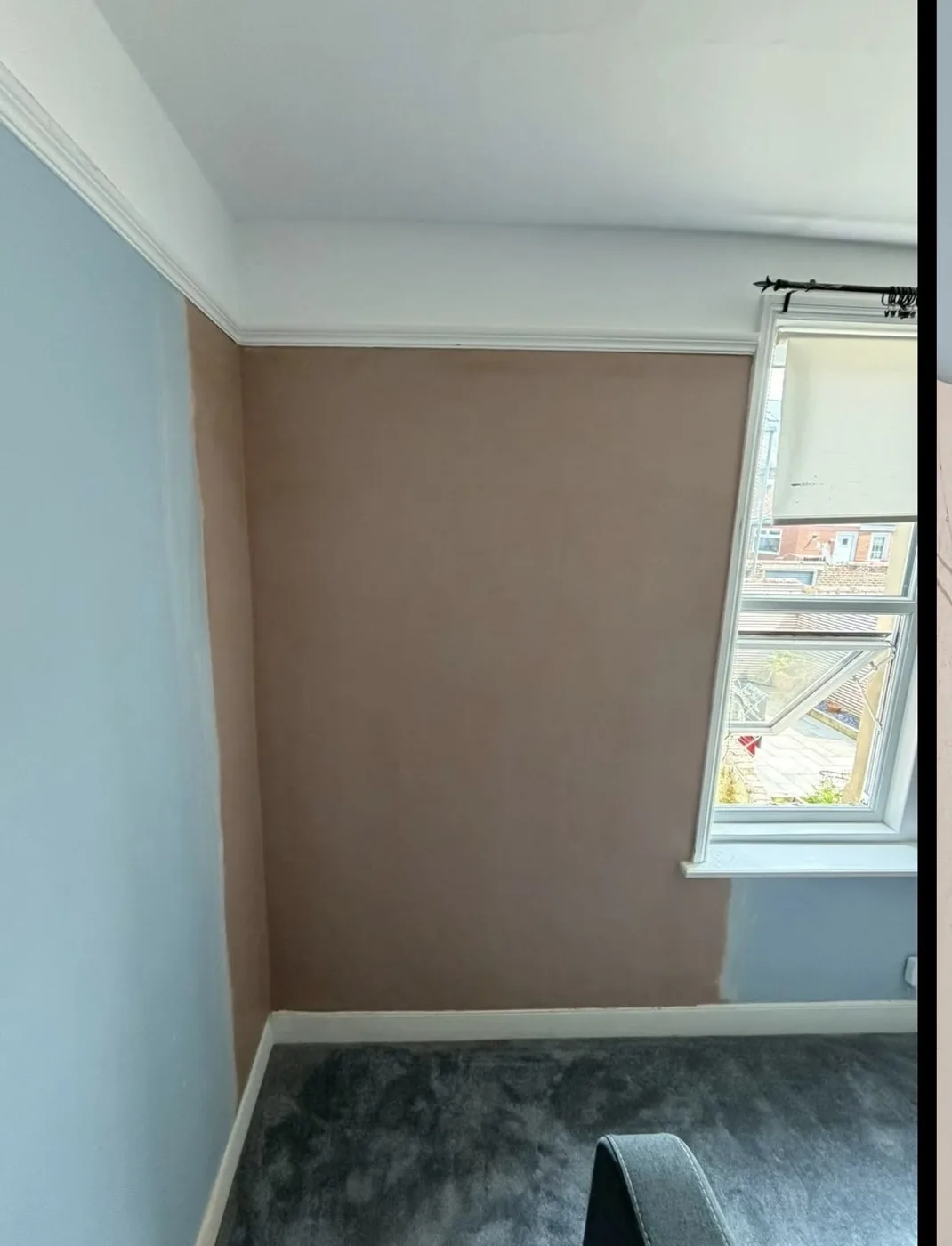 Wall repaired and re-plastered after damp ingress, then redecorated